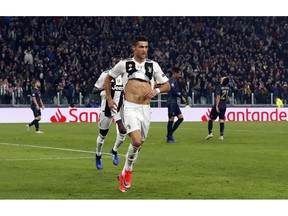 Juventus forward Cristiano Ronaldo celebrates after scoring his side's opening goal during the Champions League group H soccer match between Juventus and Manchester United at the Allianz stadium in Turin, Italy, Wednesday, Nov. 7, 2018.