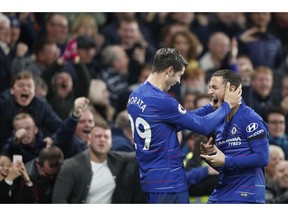 Chelsea's Alvaro Morata, left, celebrates with teammate Eden Hazard after scoring his side's second goal during the English Premier League soccer match between Chelsea and Crystal Palace at Stamford Bridge stadium in London, Sunday, Nov. 4, 2018.