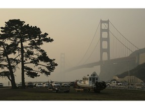 The Golden Gate Bridge is obscured by smoke and haze from wildfires Friday, Nov. 16, 2018, in this view from Fort Baker near Sausalito, Calif.