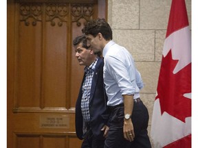 Prime Minister Justin Trudeau and Unifor National President Jerry Dias make their way to a meeting on Parliament Hill in Ottawa on Tuesday, November 27, 2018.