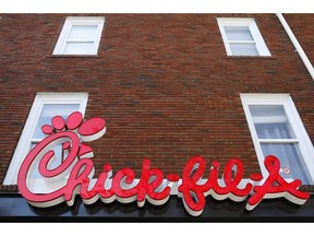 FILE - In this Oct. 30, 2018 file photo, Athens newest Chick-fil-A signage is set to open in downtown, Athens, Ga. Rider University removed the restaurant from a survey asking students what restaurants they would like on campus, "based on the company's record widely perceived to be in opposition to the LGBTQ community." The fast-food chain was included in previous surveys.   Chick-fil-A says it has "no policy of discrimination against any group."