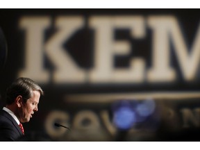 Georgia Republican gubernatorial candidate Brian Kemp speaks with supporters after a long election night in Athens, Ga., Wednesday, Nov. 7, 2018. Georgia's hotly contested and potentially historic governor's race may not be over yet, with Democrat Stacey Abrams and Kemp awaiting the final accounting of absentee and provisional ballots.