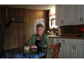 Truth Graf, 57, who served seven years in prison on a felony conviction in 2010, sits in her kitchen on election day in Woodstock, Ga., Tuesday, Nov. 6, 2018. Graf was convicted of arson and cocaine possession in what she calls "an act of desperation," when she burned her house down during the housing crisis to avoid foreclosure. Graf's right to vote won't be restored until she's off probation in 2040. She had voted before she went to prison. "I'll be 80 when I can vote again. It's devastating to me to be sitting here on election day," said Graf. "I believe so strongly in the process of having a voice and my voice has been taken away."