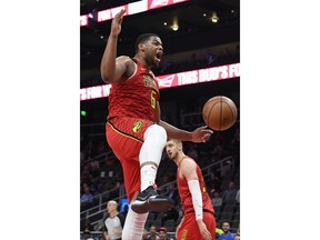 Atlanta Hawks forward Omari Spellman reacts after dunking against the New York Knicks during the first half of an NBA basketball game Wednesday, Nov. 7, 2018, in Atlanta.