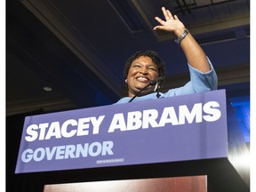 FILE - In this Tuesday, Nov. 6, 2018 file photo, Georgia Democratic gubernatorial candidate Stacey Abrams speaks to supporters during an election night watch party in Atlanta. On Tuesday, Nov. 13, 2018, The Associated Press has found that stories circulating on the internet that U.S. District Judge Leslie Abrams, sister of the gubernatorial hopeful, presided over a complaint related to the too-close-to-call governor's race, are untrue.