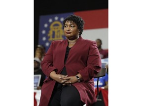 Georgia gubernatorial candidate Stracey Abrams watch as former President Barack Obama speaks during a campaign rally at Morehouse College Friday, Nov. 2, 2018, in Atlanta.