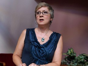 Rev. Gretta Vosper is seen at her West Hill United Church in Toronto on Wednesday, Aug. 5, 2015. An unprecedented ecclesiastical court hearing that could see the United Church defrock a self-professed atheist minister who does not believe in the Bible has been postponed indefinitely.