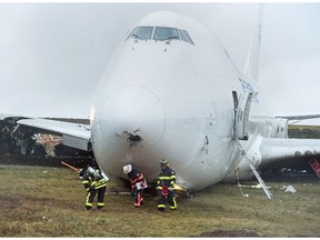 A SkyLease Cargo plane skidded off a runway at Halifax Stanfield International Airport and stopped near a road early on Wednesday, Nov. 7, 2018. The airport activated its emergency operations centre and suspended all flights after the incident where the 747 cargo plane with five people on board went off the runway. NADIAN PRESS/Andrew Vaughan