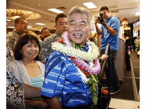 FILE - In his Aug. 11, 2018 file photo, Democratic Hawaii Gov. David Ige greets supporters at his campaign headquarters, Saturday, Aug. 11, 2018, in Honolulu. Ige is running against Republican state Rep. Andria Tupola.