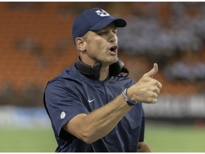 Utah State head coach Matt Wells gives the thumbs up to the game officials in the first half of an NCAA college football game, against Hawaii Saturday, Nov. 3, 2018, in Honolulu.