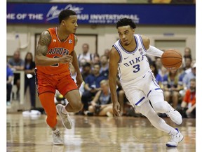 Duke guard Tre Jones (3) tries to dribble around Auburn guard Bryce Brown (2) during the first half of an NCAA college basketball game at the Maui Invitational, Tuesday, Nov. 20, 2018, in Lahaina, Hawaii.