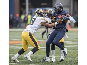 Illinois's Sam Mays (9) is tackled by Iowa's Geno Stone (9) after making a reception in the first half of a NCAA college football game Saturday, Nov. 17, 2018, in Champaign, Ill.