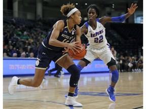 Notre Dame's Brianna Turner, left, is guarded by DePaul's Chante Stonewall during the second half of an NCAA college basketball game Saturday, Nov. 17, 2018, in Chicago.
