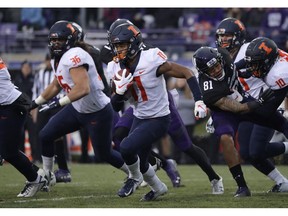 Illinois wide receiver Carlos Sandy (11) runs with the ball against Northwestern during the first half of an NCAA college football game in Evanston, Ill., Saturday, Nov. 24, 2018.