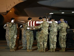 A U.S. Army carry team moves a transfer case containing the remains of Sgt. Leandro A. Jasso, Monday, Nov. 26, 2018, at Dover Air Force Base, Del. According to the Department of Defense, Jasso, 25, of Leavenworth, Wash., died Nov. 24, 2018, during combat operations in Helmand province, Afghanistan.