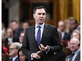 Minister of Finance Bill Morneau rises during Question Period in the House of Commons on Parliament Hill in Ottawa on Monday, Nov. 19, 2018.