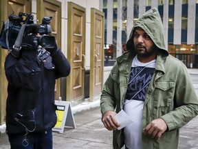 Sukhmander Singh, right, owner of the trucking company involved in the Humboldt Broncos bus crash, arrives at court to face non-compliance charges under federal and provincial safety regulations in Calgary, Alta., Friday, Nov. 9, 2018.THE CANADIAN PRESS/Jeff McIntosh