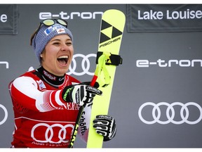 Austria's Nicole Schmidhofer celebrates her win on the podium following the women's World Cup downhill ski race at Lake Louise, Alta., Friday, Nov. 30, 2018.THE CANADIAN PRESS/Jeff McIntosh