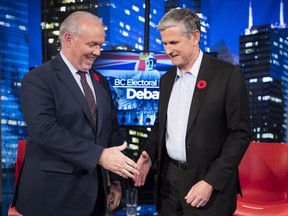 Premier John Horgan and Liberal leader Andrew Wilkinson following the Electoral Reform Debate at Global Television in Burnaby, B.C. Thursday, Nov., 8, 2018.