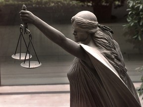 A statue of Justice is seen outside the law courts in Vancouver. The Federal Court of Appeal has certified a class action concerning the Canadian government's thalidomide compensation regime.
