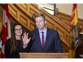 Former New Brunswick premier Brian Gallant, seen with wife Karine Gallant, announces his resignation as leader of the Liberal Party at the New Brunswick Legislature on Thursday, Nov. 15, 2018, in Fredericton.
