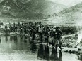 Soldiers from the Princess Patricia’s Canadian Light Infantry (PPCLI) wade through a river in Kapyong in an undated photograph from the Korean War.