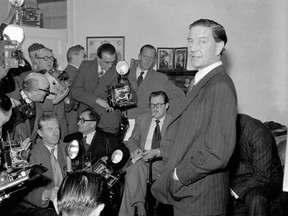 In this file photo dated Nov. 8, 1955, former British diplomat who was at that time accused of spying for Russia, during a press conference at his parents' home in London on Nov. 8, 1955.  In a 1981 film posted online Monday April 4, 2016, by the BBC, notorious British spy Kim Philby is shown in newly uncovered footage addressing East German spies, "comrades", about his life as a double agent secretly helping the Soviet Union, in what is the closest thing to a full confession yet to surface. Philby died in 1988 in his adopted Soviet homeland.