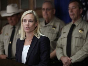 Secretary of Homeland Security Kirstjen Nielsen stands with a group of Texas sheriffs during a news conference to address sanctuary cities Tuesday, Dec. 12, 2017, in Austin, Texas.