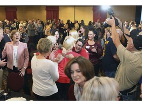 Supporters Governor-elect Laura Kelly celebrate her win over Republican Kris Kobach in Topeka, Kansas, Tuesday night, Nov. 6, 2018.