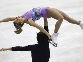 Kirsten Moore Towers and Michael Marinara of Canada perform during a pairs short program of their NHK Trophy Figure Skating in Hiroshima, western Japan, Friday, Nov. 9, 2018.