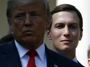 White House senior adviser Jared Kushner, right, stands behind President Donald Trump, left, during a news conference as he announces a revamped North American free trade deal, in the Rose Garden of the White House in Washington, Monday, Oct. 1, 2018. he Foreign Relations Department said Kushner earned the award “for his significant contributions in achieving the renegotiation of the new (trade) agreement between Mexico, the United States and Canada.”