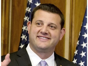 FILE - In this Jan. 6, 2015 file photo, Rep. David Valadao, R-Calif., poses during a ceremonial re-enactment of his swearing-in ceremony in the Rayburn Room on Capitol Hill in Washington. Democratic challenger T.J.Cox has edged ahead of Republican Valadao in a U.S. House race in California's farm belt, where votes continue to be counted. Cox has trailed since election night but pulled ahead by 438 votes Monday, Nov. 26, 2018, according to tallies in the 21st District that cuts through four Central Valley counties. The Associated Press had declared Valadao the winner, but votes that have been counted since Nov. 6 narrowed the race and the AP retracted its race call on Monday.