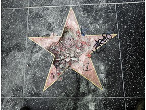 FILE - This July 25, 2018 file photo shows Donald Trump's star on the Hollywood Walk of Fame after it was vandalized in Los Angeles. The man who smashed the star on has been sentenced to three years' probation after pleading no contest to a felony count of vandalism. A judge also sentenced Austin Mikel Clay on Wednesday, Nov. 7, 2018, to attend psychological counseling and pay more than $9,400 to the Hollywood Chamber of Commerce.
