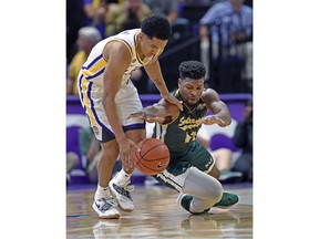 LSU guard Tremont Waters (3) knocks the ball loose from Southeastern Louisiana forward Moses Greenwood (13) in the first half of an NCAA college basketball game, Tuesday, Nov. 6, 2018, in Baton Rouge, La.