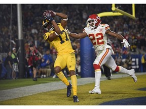 Los Angeles Rams wide receiver Robert Woods (17) catches a pass for a touchdown ahead of Kansas City Chiefs defensive back Orlando Scandrick (22) during the first half of an NFL football game Monday, Nov. 19, 2018, in Los Angeles.