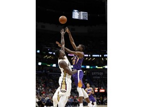 Phoenix Suns forward Josh Jackson shoots against New Orleans Pelicans forward Julius Randle, left, in the first half of an NBA basketball game in New Orleans, Saturday, Nov. 10, 2018.