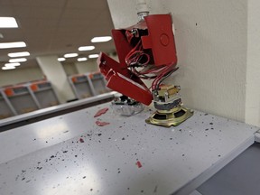 A broken fire alarm is shown in the visitors locker room at Paul Brown Stadium in Cincinnati, Sunday, Nov. 11, 2018. The New Orleans Saints played the Cincinnati Bengals on Sunday. Saints coach Sean Payton says he broke a blaring fire alarm in visitor's locker room at Cincinnati's Paul Brown stadium and that he intends to ensure the repairs are paid for. Payton says it would be "a little sensationalist" to say he "destroyed" the fire alarm and that the act was not intended as a motivational ploy. Rather, Payton says the alarm had been blaring for what seemed to him like 10 minutes and that he "needed the noise to stop" as he prepared his team to play against the Bengals.