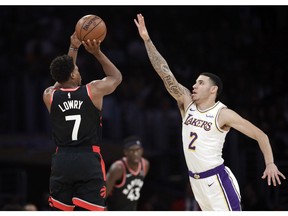 Toronto Raptors' Kyle Lowry (7) shoots over Los Angeles Lakers' Lonzo Ball (2) during the first half of an NBA basketball game Sunday, Nov. 4, 2018, in Los Angeles.