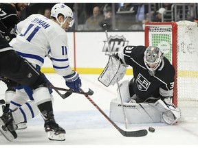 Toronto Maple Leafs left wing Zach Hyman, left, tries to get a shot past Los Angeles Kings goaltender Peter Budaj, of Slovakia, during the first period of an NHL game Tuesday, Nov. 13, 2018, in Los Angeles.