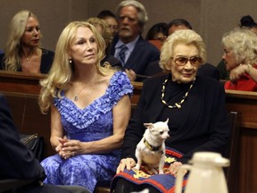 In this Sept. 10, 2018, file photo, Abigail Kawananakoa, right, and her wife Veronica Gail Worth, appear in state court in Honolulu. Records show the 92-year-old Native Hawaiian princess has changed her trust to ensure that her wife receives $40 million and all her personal property, including her Chihuahua "Girlie Girl."