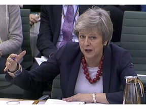 Prime Minister Theresa May gives evidence before the Liaison Committee on matters relating to Brexit at Portcullis House in London, Thursday, Nov. 29, 2018. The governor of the Bank of England Mark Carney says most British businesses aren't ready for a no-deal departure from the European Union as lawmakers from all parties are criticising the agreement Prime Minister May negotiated with the EU, increasing the likelihood of a no-deal Brexit.