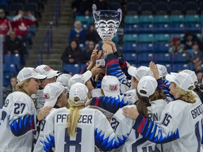 United States players celebrate their victory over Canada in 2018 Four Nations Cup gold medal game action in Saskatoon, Saturday, Nov. 10, 2018. The United States defeated Canada 5-2.