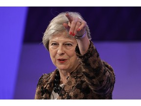 Britain's Prime Minister Theresa May delivers a speech at the CBI annual conference in London, Monday, Nov. 19, 2018. Theresa May said in a speech to business lobby group the Confederation of British Industry that the deal "fulfils the wishes of the British people" to leave the EU, by taking back control of the U.K.'s laws, money and borders.