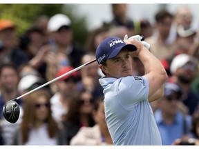 FILE - In this file photo dated Sunday, April 15, 2018, Paul Dunne of Ireland tees off during the Spanish Open Golf tournament in Madrid. Dunne shot a bogey-free, 7-under 64 to take a one-stroke lead after the first round of the Turkish Airlines Open in Antalya, Turkey, on Thursday, Nov. 1, 2018.