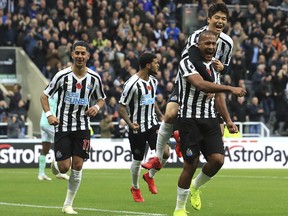 Newcastle United's Salomon Rondon, right, celebrates scoring his side's first goal of the game with Sung-Yeung Ki  during the English Premier League soccer match between Newcastle United and AFC Bournemouth at St James Park stadium, Newcastle, England. Saturday Nov. 10 2018