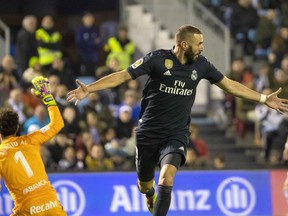 Real Madrid's Karim Benzema scores the first goal during a Spanish La Liga soccer match between RC Celta and Real Madrid at the Balaidos stadium in Vigo, Spain, Sunday, November 11, 2018.
