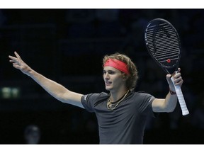 Alexander Zverev of Germany celebrates winning match point against John Isner of the United States in their ATP World Tour Finals singles tennis match at the O2 Arena in London, Friday Nov. 16, 2018.