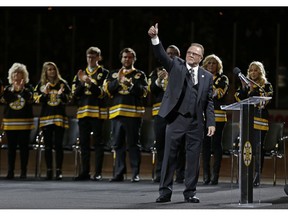 Boston Bruins great Rick Middleton acknowledges the fans during a ceremony to retire his No. 16, before an NHL hockey game between the Bruins and the New York Islanders on Thursday, Nov. 29, 2018, in Boston.