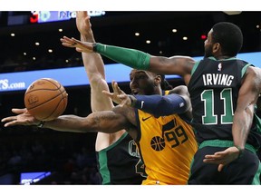 Utah Jazz's Jae Crowder (99) passes the ball against Boston Celtics' Kyrie Irving (11) during the first half on an NBA basketball game in Boston, Saturday, Nov. 17, 2018.