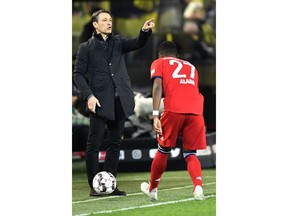 Bayern coach Niko Kovac instructs his players during the German Bundesliga soccer match between Borussia Dortmund and FC Bayern Munich in Dortmund, Germany, Saturday, Nov. 10, 2018.